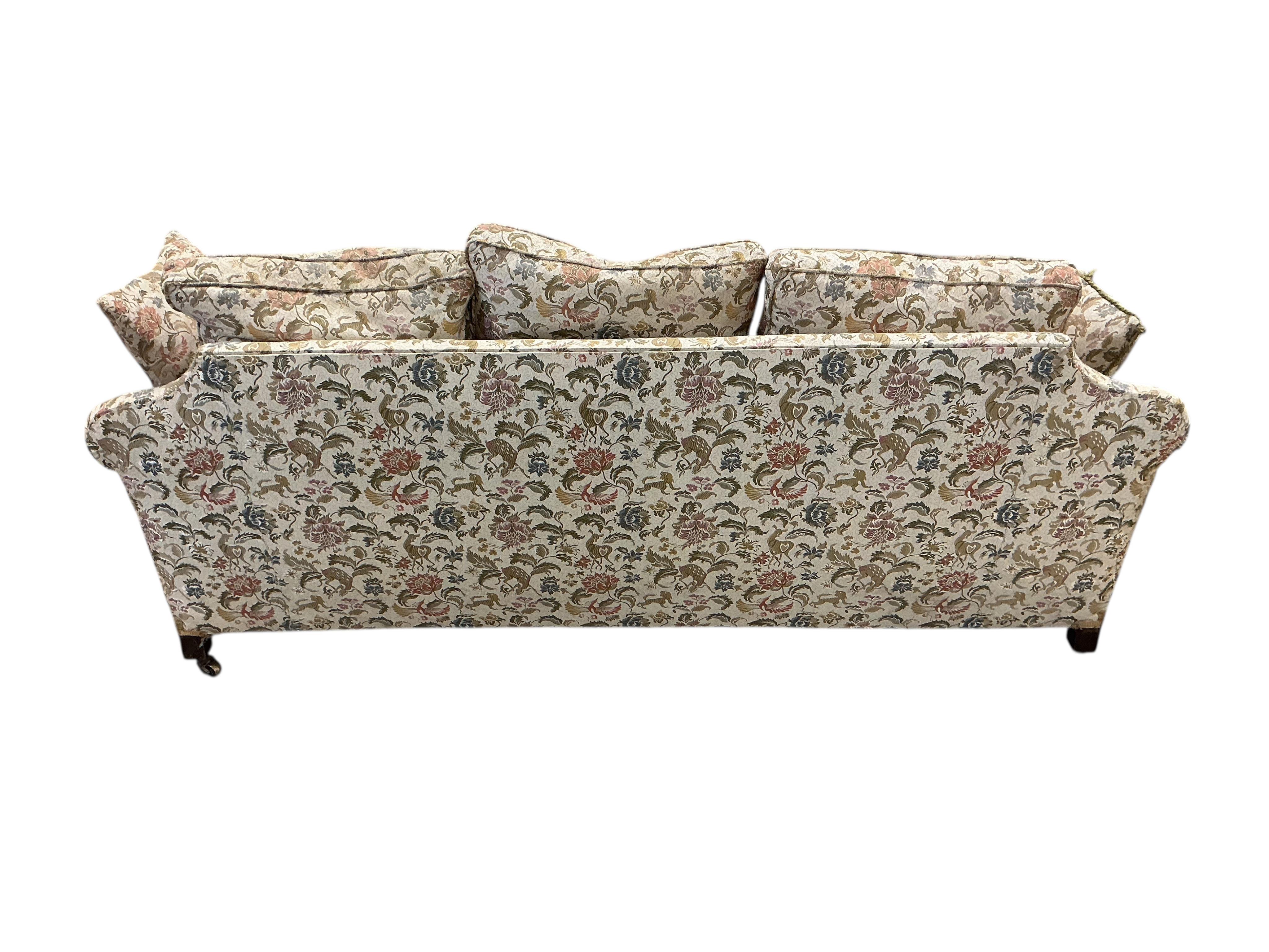 An early 20th century mahogany bergere settee, now upholstered, width 196cm, depth 92cm, height 84cm